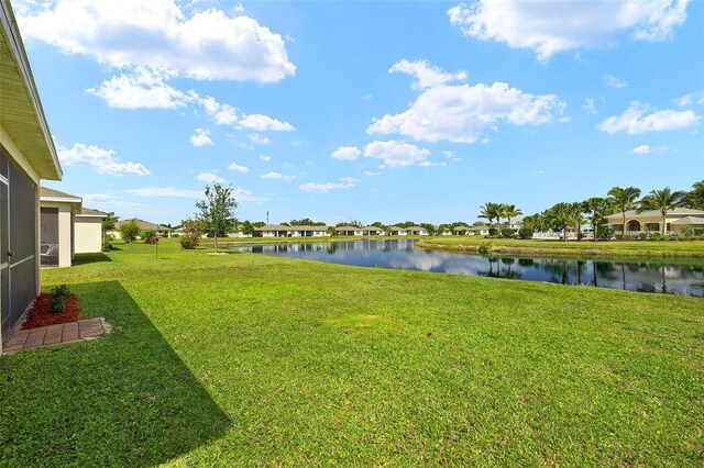5358 Shell Mound Cir, Punta Gorda, FL 33982 - view of green lawn with a water view
