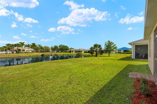 5358 Shell Mound Cir, Punta Gorda, FL 33982 - view of green lawn with a water view