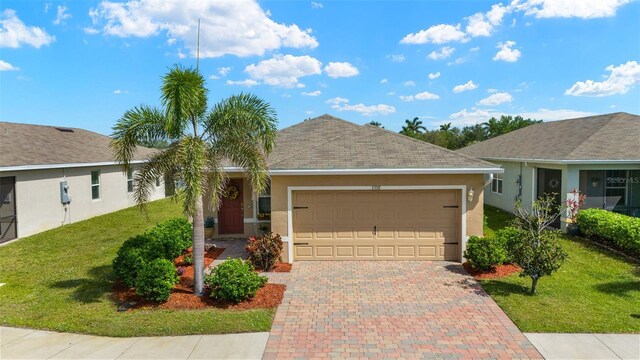 5358 Shell Mound Cir, Punta Gorda, FL 33982 - ranch-style house featuring stucco siding, a garage, a front lawn, and decorative driveway