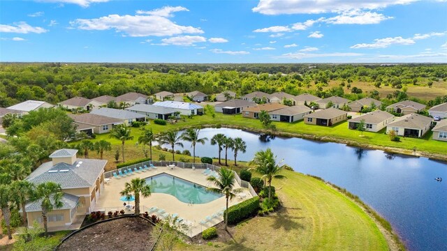 5358 Shell Mound Cir, Punta Gorda, FL 33982 - aerial perspective of suburban area featuring a pool area, a nearby body of water, and a forest