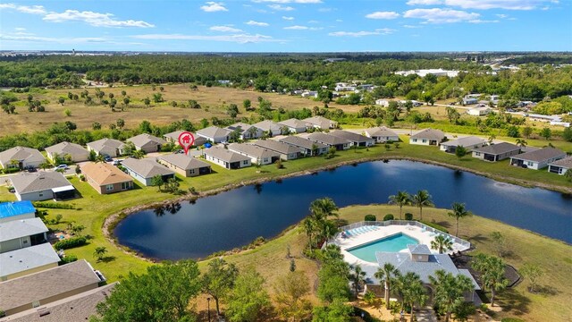 5358 Shell Mound Cir, Punta Gorda, FL 33982 - aerial perspective of suburban area with a pool and a nearby body of water