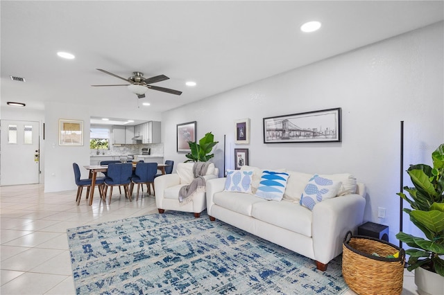 3203 Riverside Dr Unit B, Punta Gorda, FL 33950 - living area with light tile patterned floors, recessed lighting, and a ceiling fan