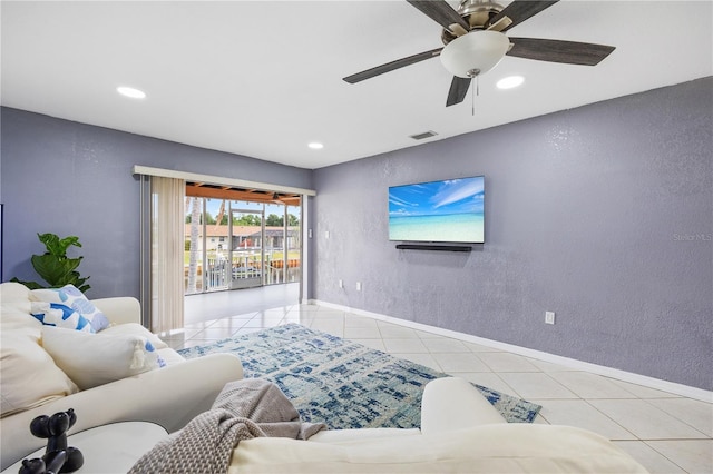 3203 Riverside Dr Unit B, Punta Gorda, FL 33950 - living room featuring light tile patterned floors, recessed lighting, baseboards, a textured wall, and a ceiling fan