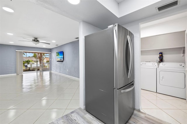 3203 Riverside Dr Unit B, Punta Gorda, FL 33950 - kitchen with freestanding refrigerator, ceiling fan, separate washer and dryer, baseboards, and recessed lighting