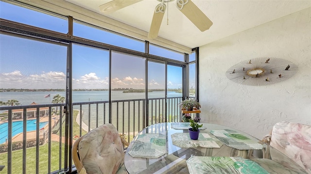 8897 Midnight Pass Rd Unit 407, Sarasota, FL 34242 - sunroom / solarium featuring a water view and a textured wall