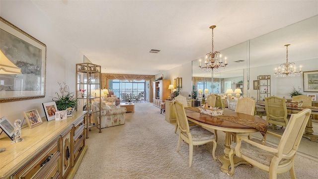 8897 Midnight Pass Rd Unit 407, Sarasota, FL 34242 - dining space featuring a chandelier and light colored carpet