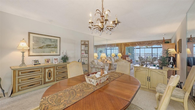 8897 Midnight Pass Rd Unit 407, Sarasota, FL 34242 - dining area with a chandelier, light colored carpet, and a textured ceiling