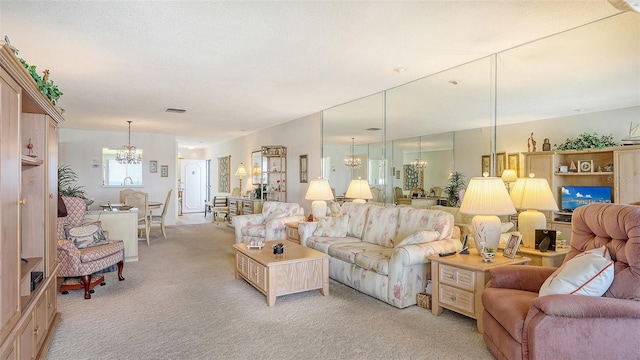 8897 Midnight Pass Rd Unit 407, Sarasota, FL 34242 - living room with a chandelier and light carpet
