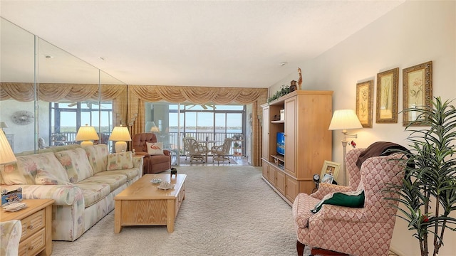 8897 Midnight Pass Rd Unit 407, Sarasota, FL 34242 - living room featuring light colored carpet and healthy amount of natural light