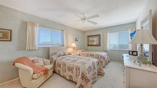 8897 Midnight Pass Rd Unit 407, Sarasota, FL 34242 - bedroom featuring light colored carpet, baseboards, a textured ceiling, and a ceiling fan