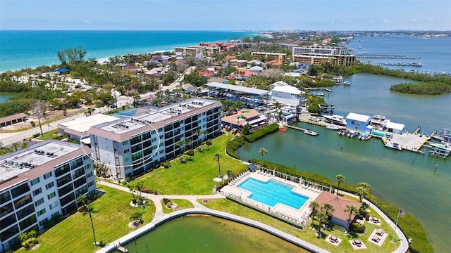 8897 Midnight Pass Rd Unit 407, Sarasota, FL 34242 - drone / aerial view of a large body of water and a pool area