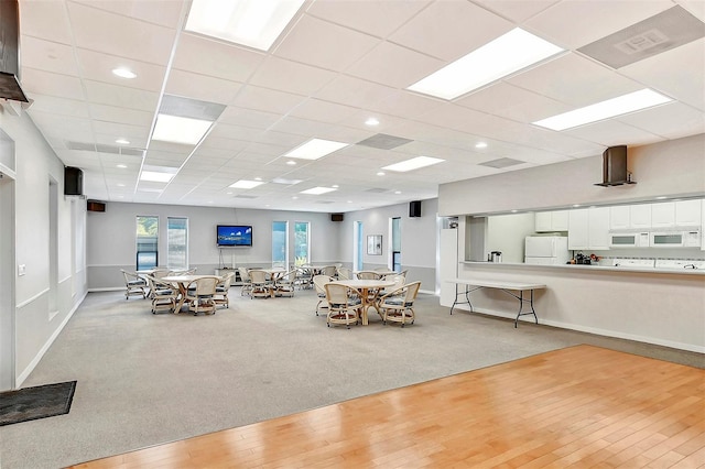 8897 Midnight Pass Rd Unit 407, Sarasota, FL 34242 - dining area featuring light carpet, light wood-style floors, and a drop ceiling