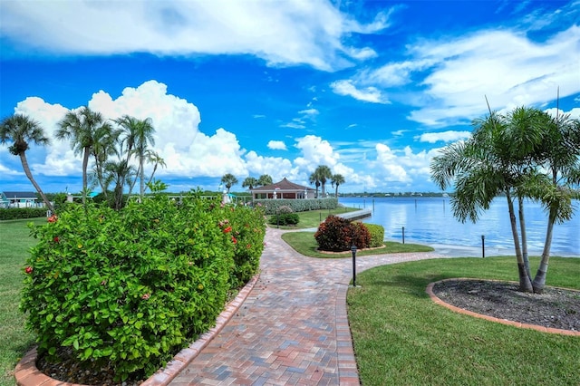 8897 Midnight Pass Rd Unit 407, Sarasota, FL 34242 - surrounding community with a yard and a water view