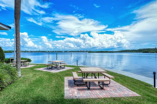 8897 Midnight Pass Rd Unit 407, Sarasota, FL 34242 - surrounding community with a water view, a yard, and a patio
