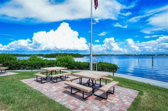 8897 Midnight Pass Rd Unit 407, Sarasota, FL 34242 - view of property's community featuring a water view, a yard, a patio area, and outdoor dining area