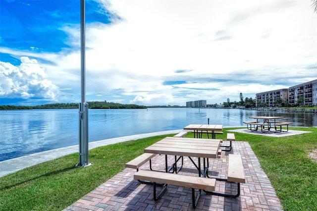 8897 Midnight Pass Rd Unit 407, Sarasota, FL 34242 - surrounding community with a yard and a water view