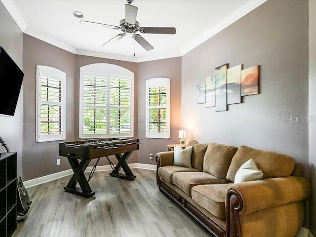 312 148th Ct NE, Bradenton, FL 34212 - living area featuring wood finished floors, baseboards, crown molding, and ceiling fan