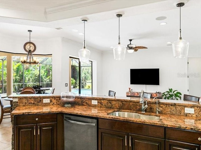 312 148th Ct NE, Bradenton, FL 34212 - kitchen with dishwasher, a sink, dark brown cabinetry, stone countertops, and hanging light fixtures