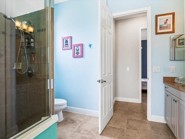 312 148th Ct NE, Bradenton, FL 34212 - bathroom featuring vanity, a stall shower, toilet, and baseboards