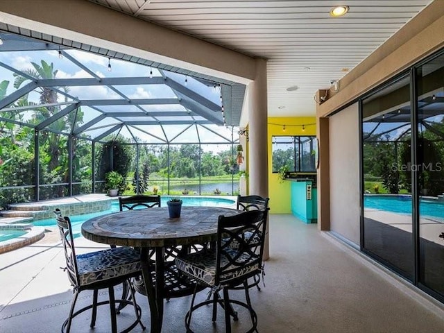 312 148th Ct NE, Bradenton, FL 34212 - view of patio with an in-ground hot tub, an outdoor pool, and glass enclosure