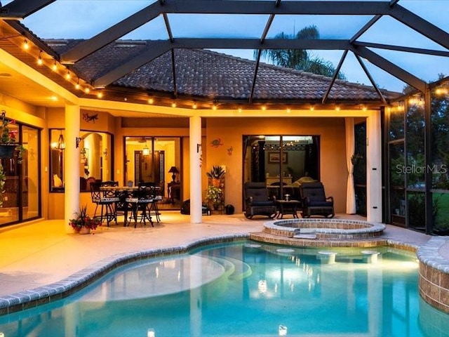 312 148th Ct NE, Bradenton, FL 34212 - view of pool featuring a patio area, glass enclosure, and a pool with connected hot tub