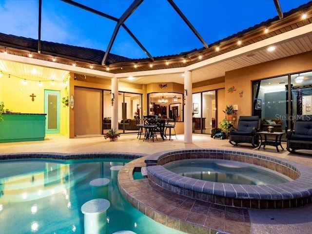 312 148th Ct NE, Bradenton, FL 34212 - view of pool featuring a patio, a lanai, and a pool with connected hot tub