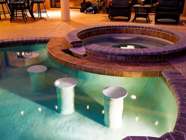 312 148th Ct NE, Bradenton, FL 34212 - exterior view of a swimming pool and a jacuzzi