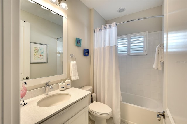 8077 Sandstar Way, Sarasota, FL 34240 - bathroom featuring toilet, vanity, and shower / tub combo