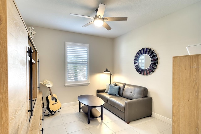 8077 Sandstar Way, Sarasota, FL 34240 - sitting room featuring ceiling fan, baseboards, and light tile patterned floors
