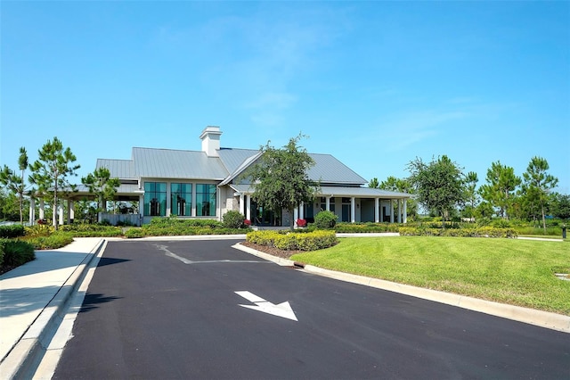 8077 Sandstar Way, Sarasota, FL 34240 - view of building exterior featuring uncovered parking