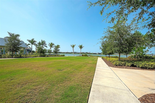 8077 Sandstar Way, Sarasota, FL 34240 - surrounding community with a water view and a yard