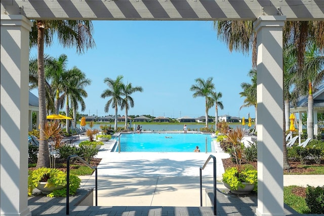8077 Sandstar Way, Sarasota, FL 34240 - community pool with a patio area