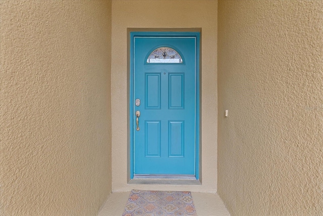 5618 Sheer Bliss Loop, Land O Lakes, FL 34639 - doorway to property featuring stucco siding