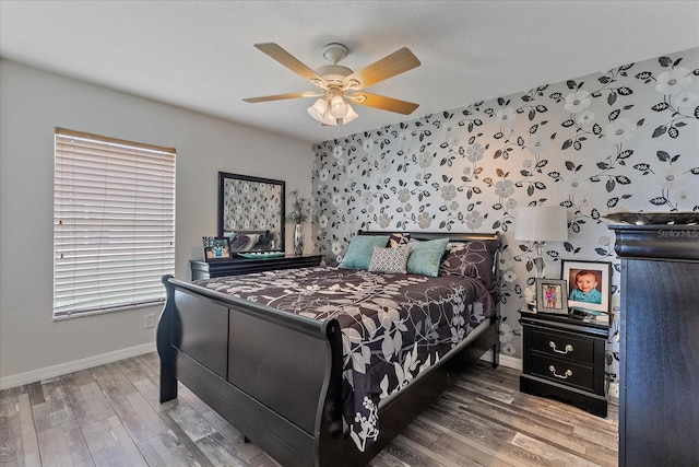 5618 Sheer Bliss Loop, Land O Lakes, FL 34639 - bedroom with baseboards, wood finished floors, a ceiling fan, and wallpapered walls