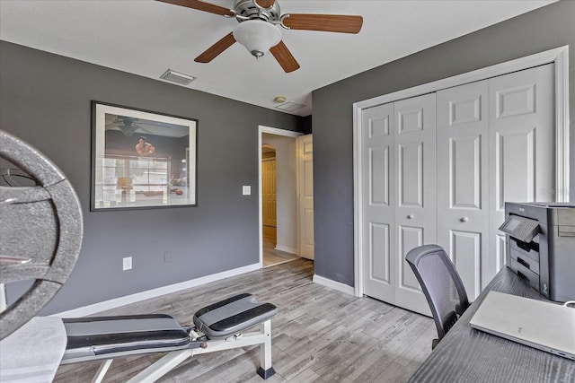 5618 Sheer Bliss Loop, Land O Lakes, FL 34639 - office area featuring a ceiling fan, light wood finished floors, and baseboards