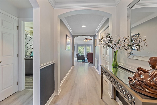 5618 Sheer Bliss Loop, Land O Lakes, FL 34639 - hallway with arched walkways, ornamental molding, light wood-style flooring, baseboards, and recessed lighting