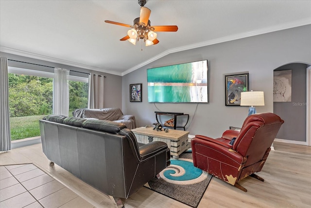 5618 Sheer Bliss Loop, Land O Lakes, FL 34639 - living room with vaulted ceiling, ornamental molding, arched walkways, light wood-type flooring, and a ceiling fan