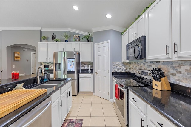 5618 Sheer Bliss Loop, Land O Lakes, FL 34639 - kitchen featuring appliances with stainless steel finishes, ornamental molding, a sink, light tile patterned flooring, and white cabinets