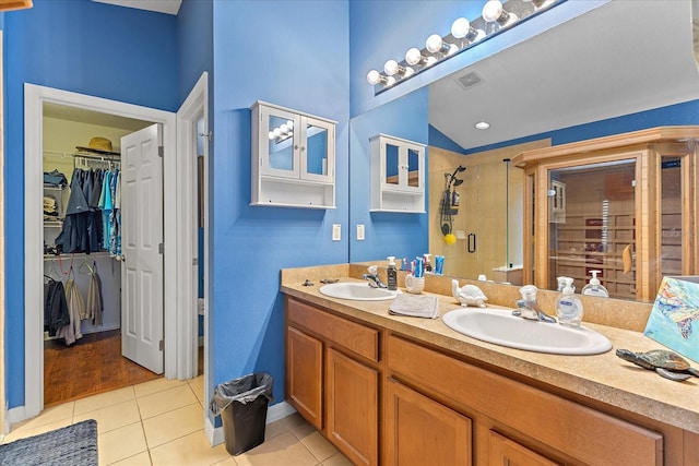 5618 Sheer Bliss Loop, Land O Lakes, FL 34639 - full bath featuring tile patterned flooring, a shower stall, double vanity, and a walk in closet