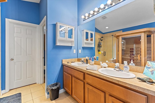 5618 Sheer Bliss Loop, Land O Lakes, FL 34639 - full bathroom with tile patterned floors, double vanity, a stall shower, and baseboards