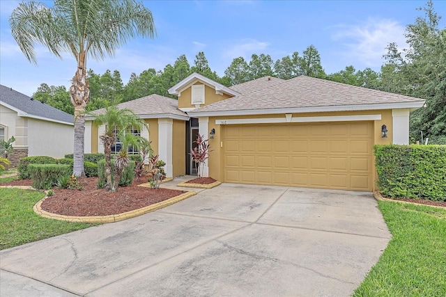 5618 Sheer Bliss Loop, Land O Lakes, FL 34639 - ranch-style house featuring stucco siding, concrete driveway, a garage, and a shingled roof