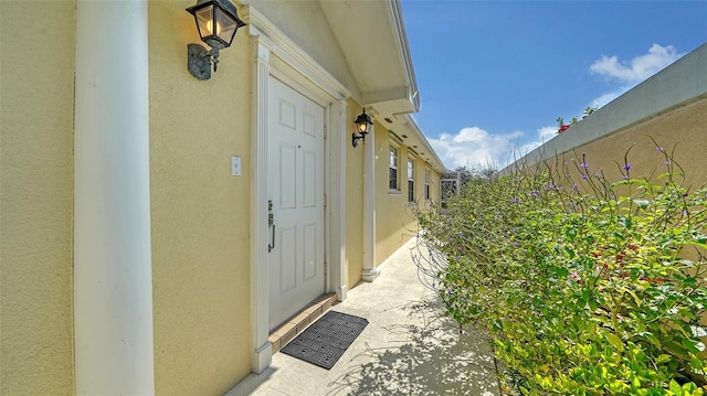 5566 Avellino Pl, Sarasota, FL 34238 - doorway to property featuring stucco siding