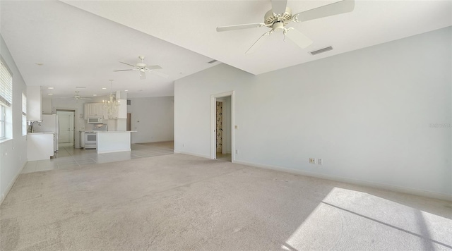 5566 Avellino Pl, Sarasota, FL 34238 - unfurnished living room with a ceiling fan, light carpet, and baseboards