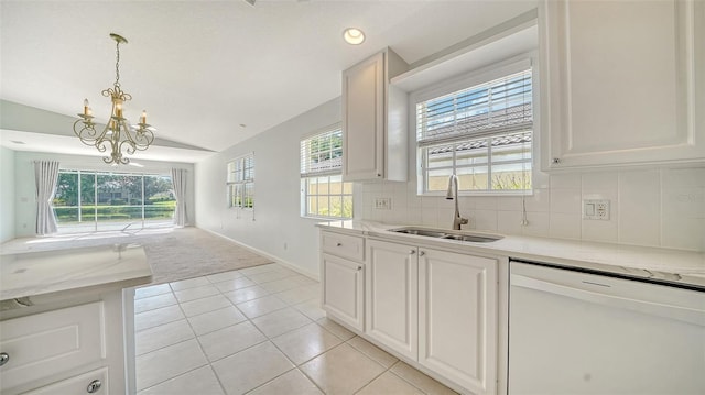 5566 Avellino Pl, Sarasota, FL 34238 - kitchen featuring white dishwasher, vaulted ceiling, a sink, a chandelier, and light tile patterned floors