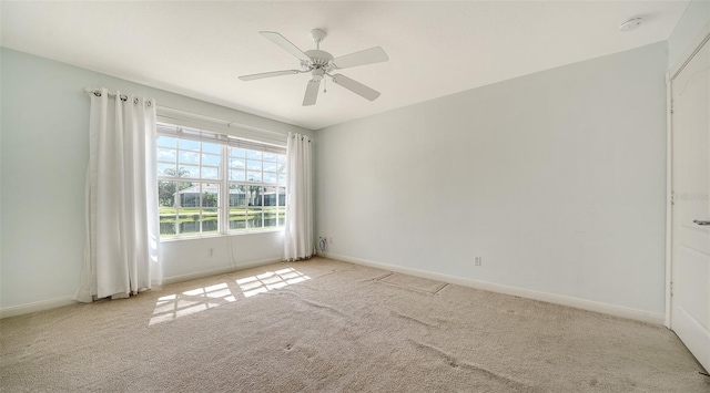 5566 Avellino Pl, Sarasota, FL 34238 - carpeted spare room featuring baseboards, a smoke detector, and a ceiling fan