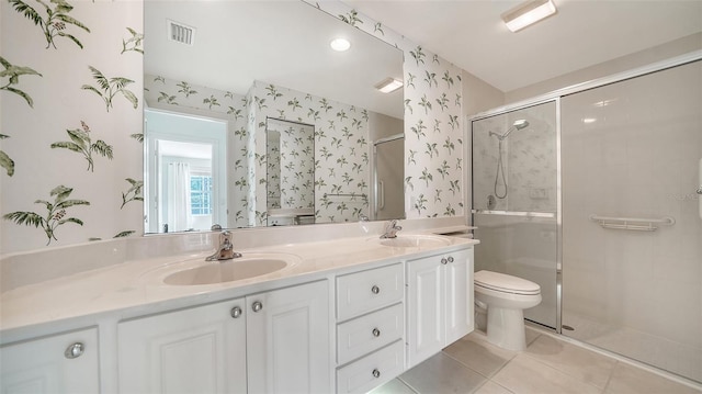5566 Avellino Pl, Sarasota, FL 34238 - bathroom featuring toilet, double vanity, a shower stall, wallpapered walls, and tile patterned floors