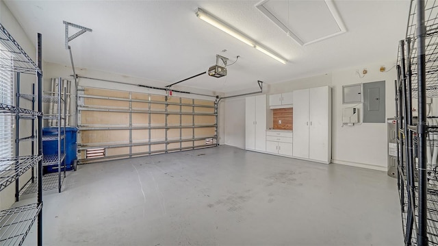 5566 Avellino Pl, Sarasota, FL 34238 - garage with electric panel and a garage door opener