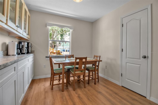 951 Varet Rd, Venice, FL 34293 - dining area with light wood-type flooring and baseboards