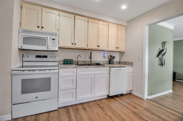 951 Varet Rd, Venice, FL 34293 - kitchen with white appliances, a sink, light wood-style flooring, baseboards, and recessed lighting
