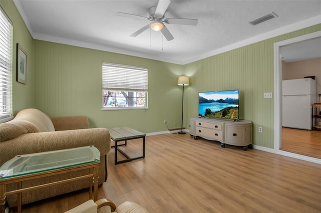 951 Varet Rd, Venice, FL 34293 - living room featuring wood finished floors, a ceiling fan, baseboards, and ornamental molding